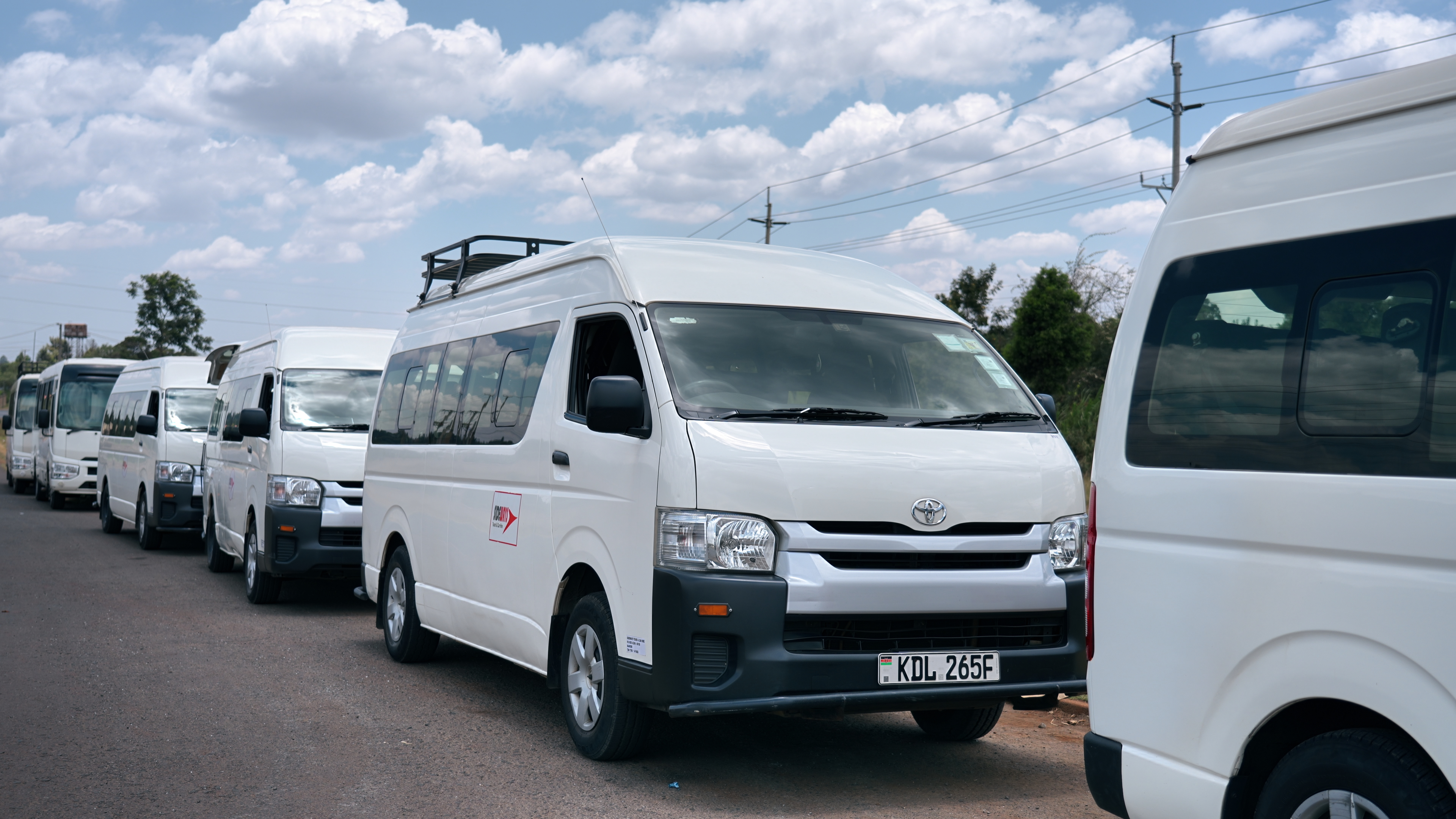 Sideways staff shuttle vehicles lined up